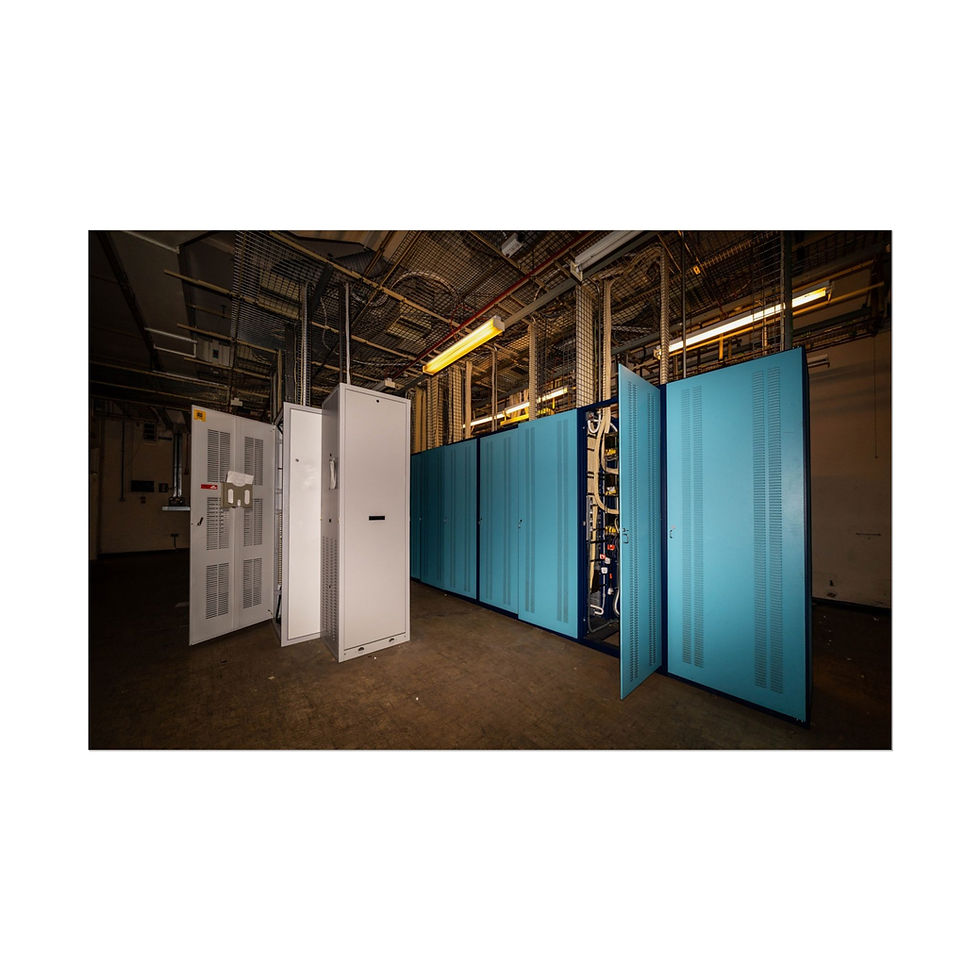 Thumbnail: Server room with rows of blue covered racks and open equipment.