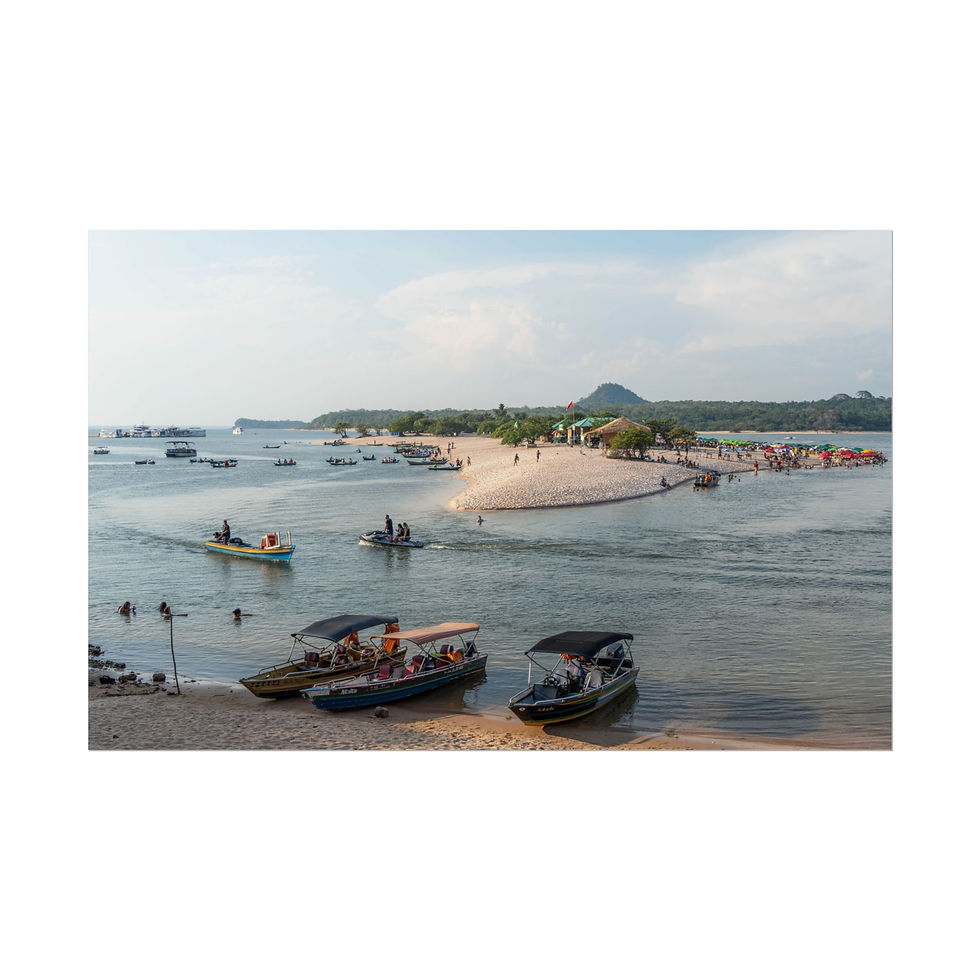 Thumbnail: Boats near sandy spit with people wading in tropical waters.