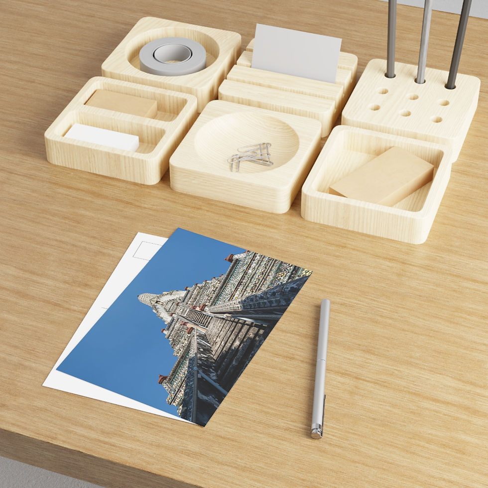 Thumbnail: Wooden desk organizer, business cards, pens, tape, postcard, pen on table.