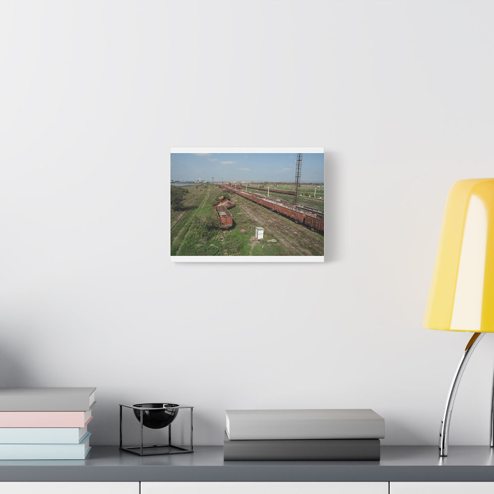 Thumbnail: Red train on tracks through green field from aerial perspective.