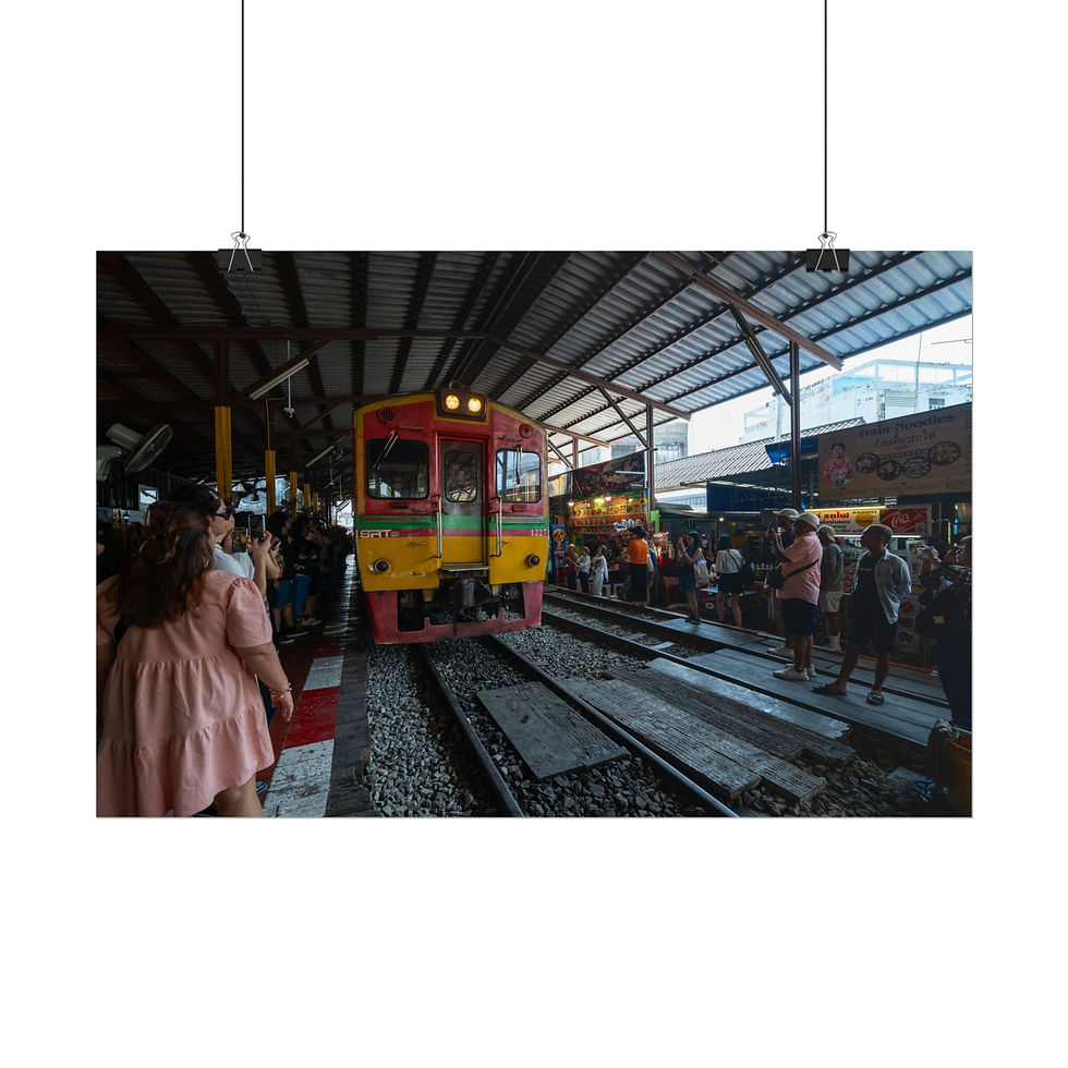 Thumbnail: Red and yellow train arrives at a busy station platform with many people.
