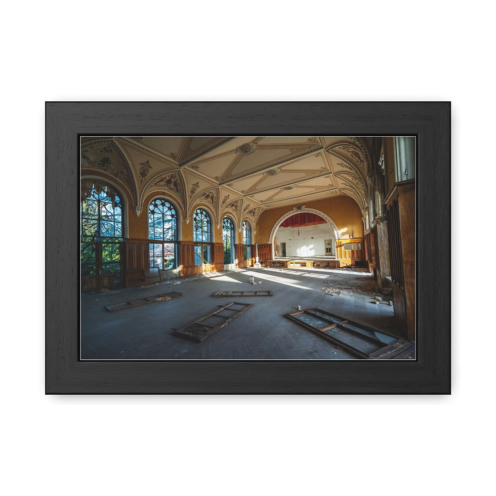 Thumbnail: Abandoned ornate hall with sunlight streaming through large arched windows.