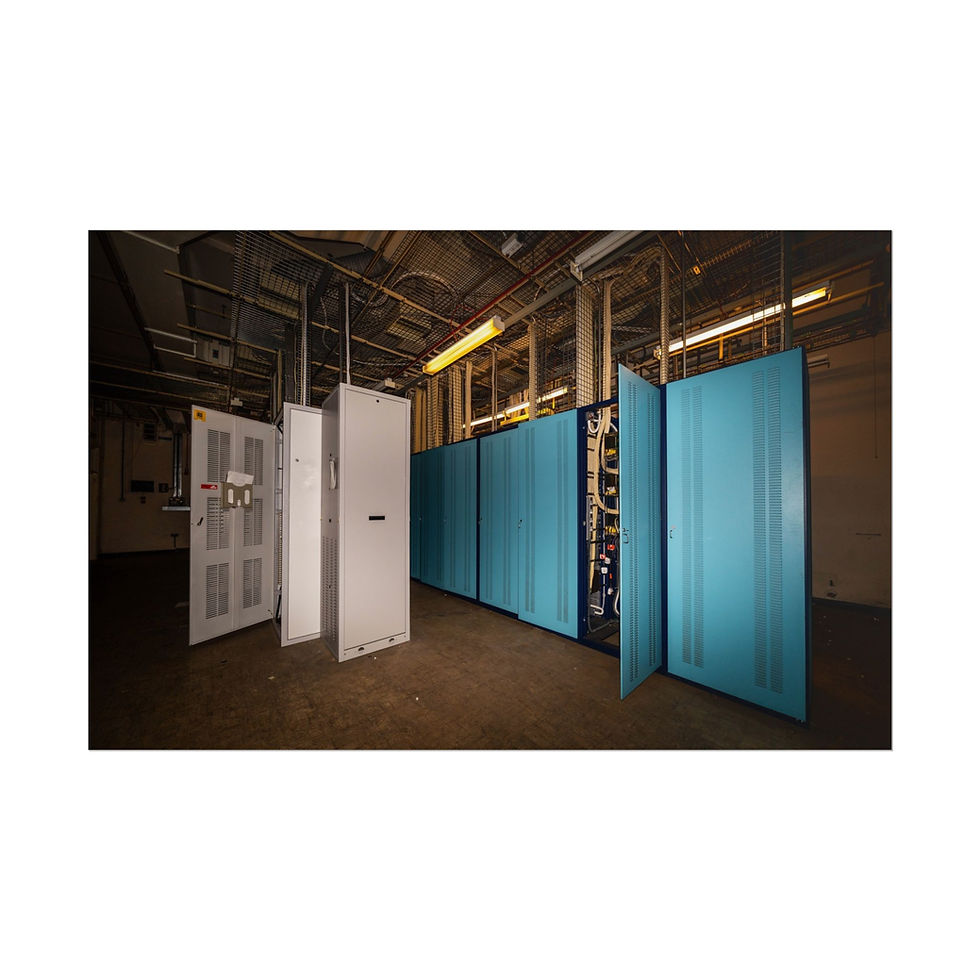 Thumbnail: Data center with multiple rows of white and teal server cabinets.