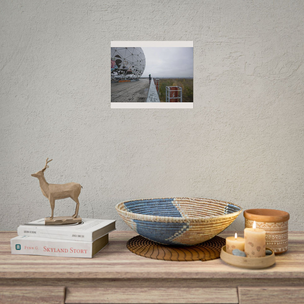Thumbnail: Framed picture: lone person near large white sphere, desolate landscape.