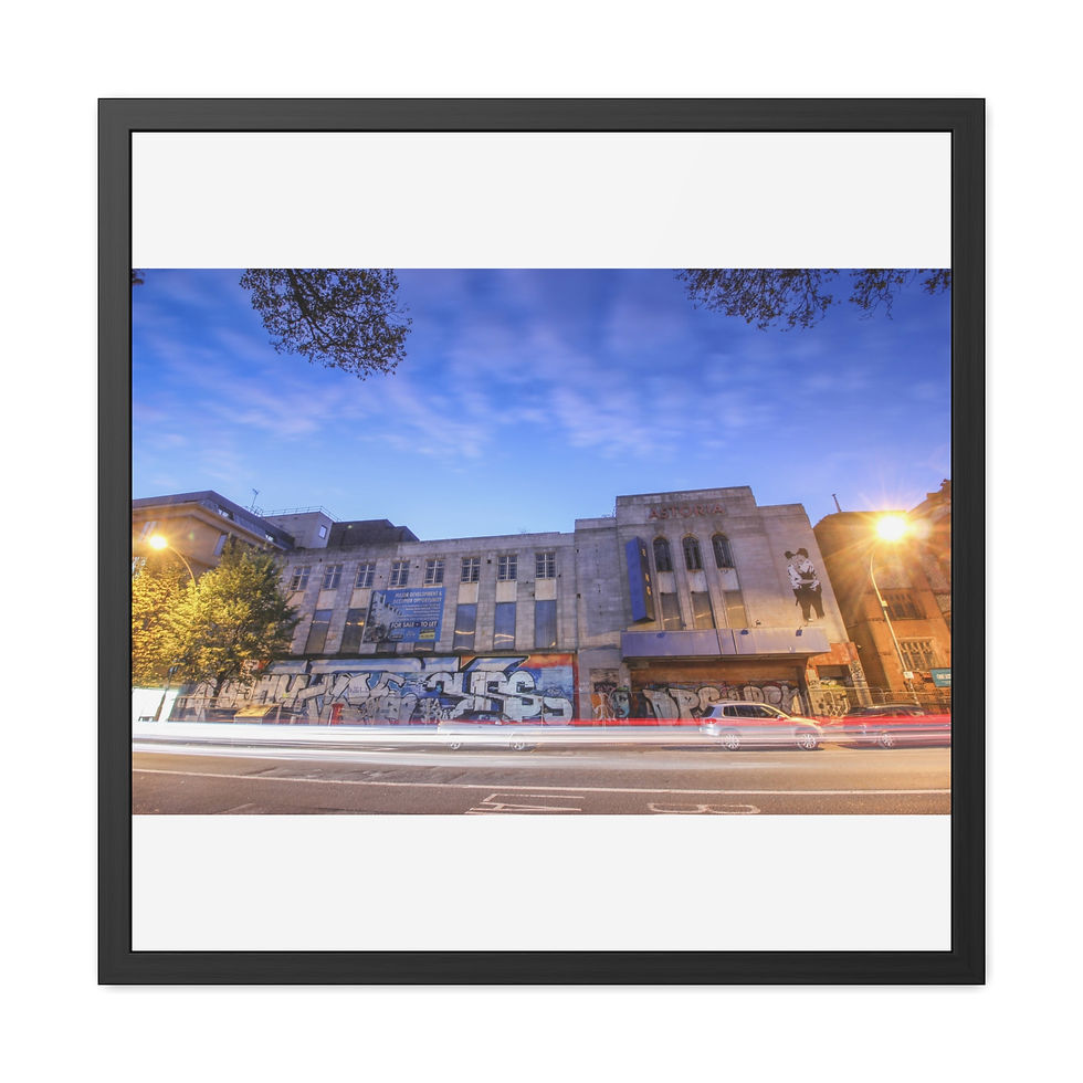 Thumbnail: Long exposure night shot of a building with light trails on road.