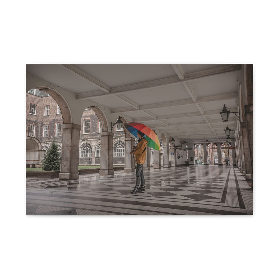 Thumbnail: Person holds rainbow umbrella under historic arches, Central London courtyard.