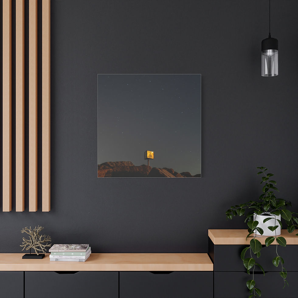 Thumbnail: Dark square wall art shows a lone yellow sign on a distant hill.