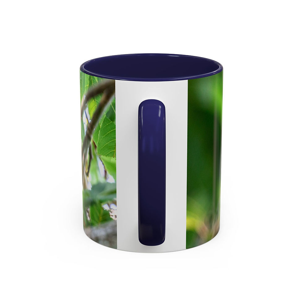 Thumbnail: White ceramic mug with dark blue interior, handle, and leaf design.