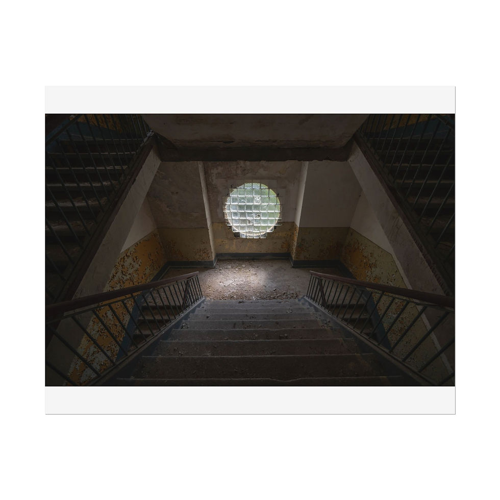 Thumbnail: Dark, decaying symmetrical stairwell in an abandoned building with circular window.