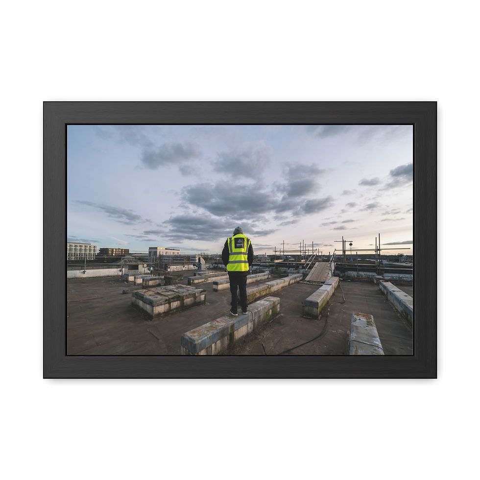 Thumbnail: Person in hi-vis vest on urban rooftop under cloudy sky.