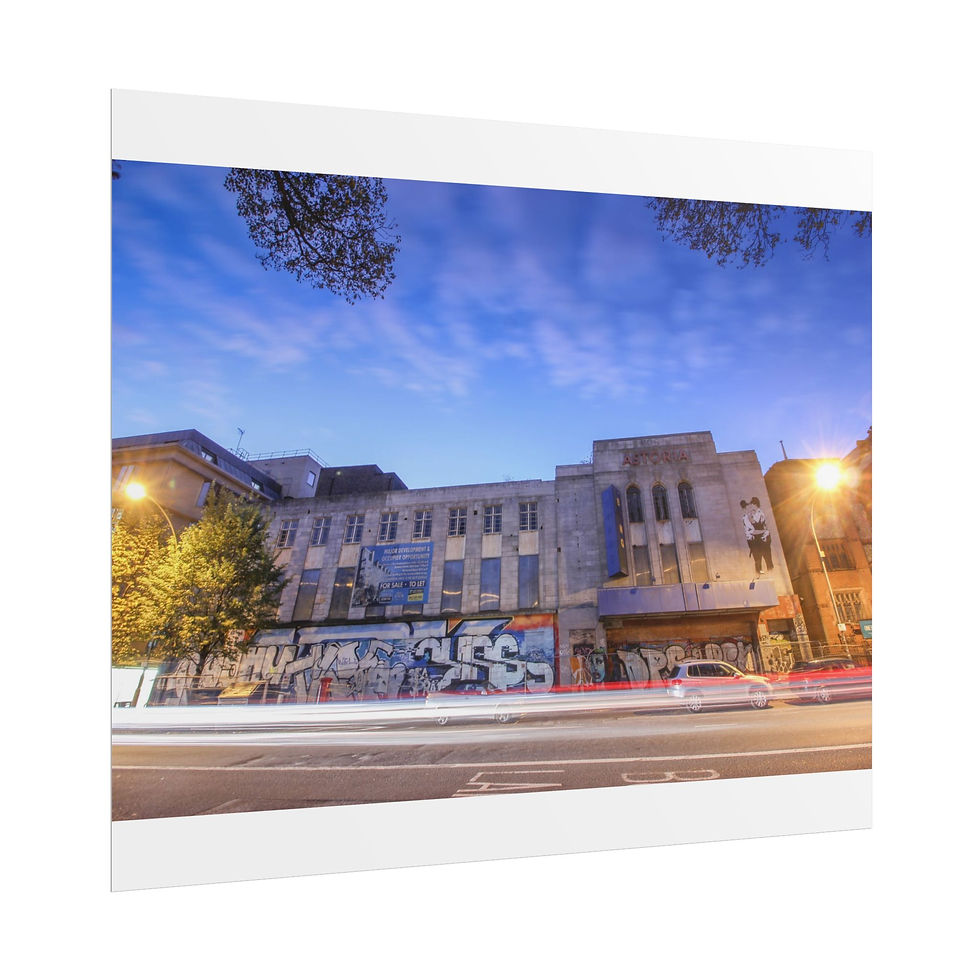 Thumbnail: Urban building with graffiti, car light trails, and streetlights at dusk.