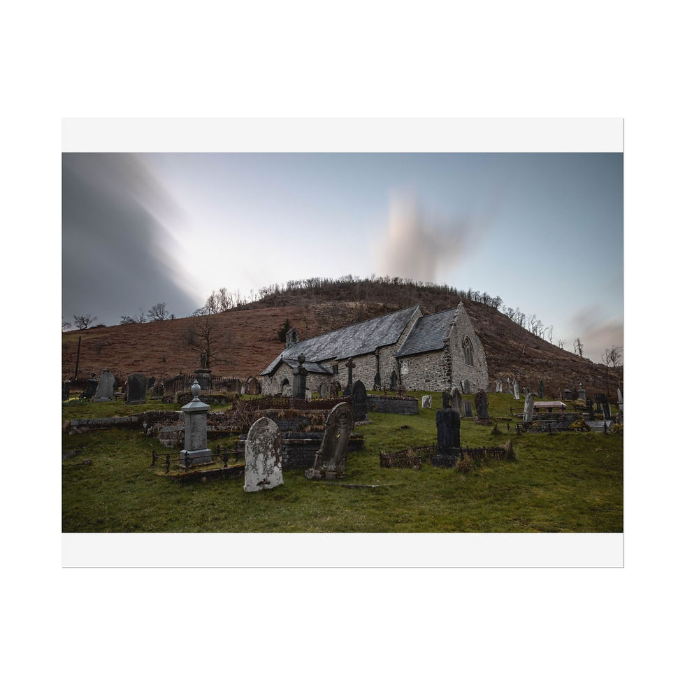 Thumbnail: Historic stone church, gravestones, grassy cemetery, and cloudy sky over hill.