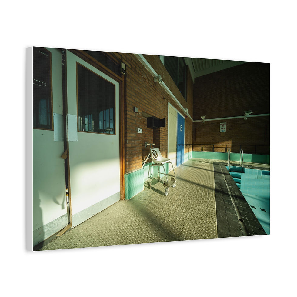 Thumbnail: Empty indoor swimming pool, sunlight streaming through door, tiled floor, brick walls.