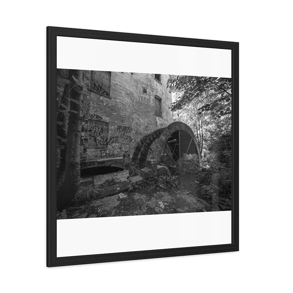 Thumbnail: Black and white framed photo of an ancient stone water mill.