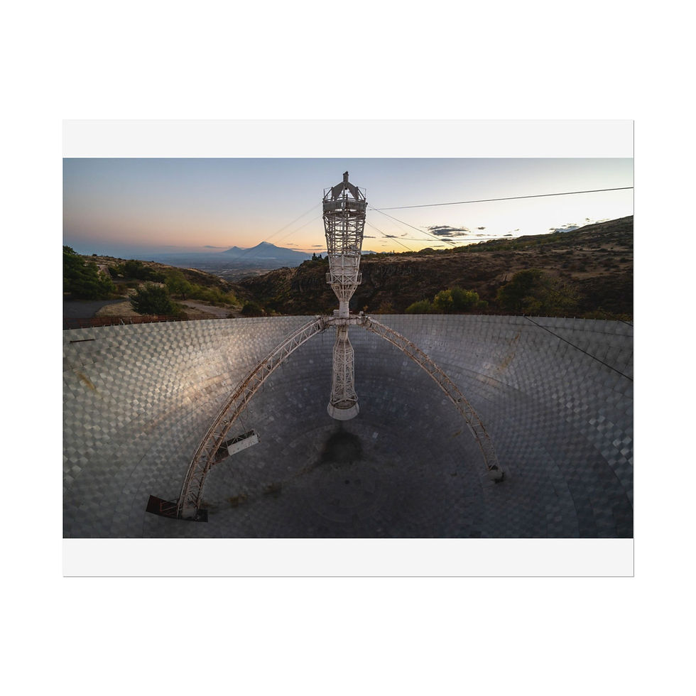 Thumbnail: Abandoned radio telescope dish with central tower, mountains, and sunset sky.