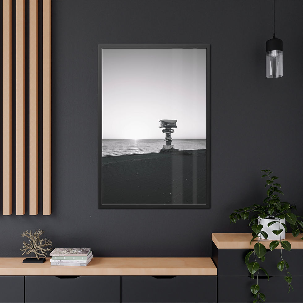 Thumbnail: Black and white photo of a stone structure at sunrise over calm water.