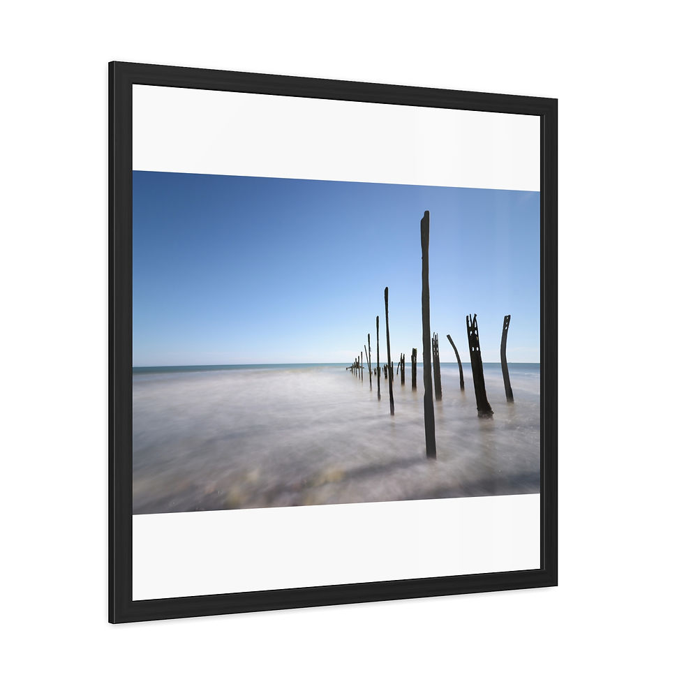Thumbnail: Black framed art print, wooden pilings in misty water, blue sky.