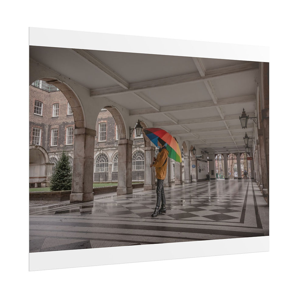 Thumbnail: Person holding vibrant umbrella walks under long, arched walkway.