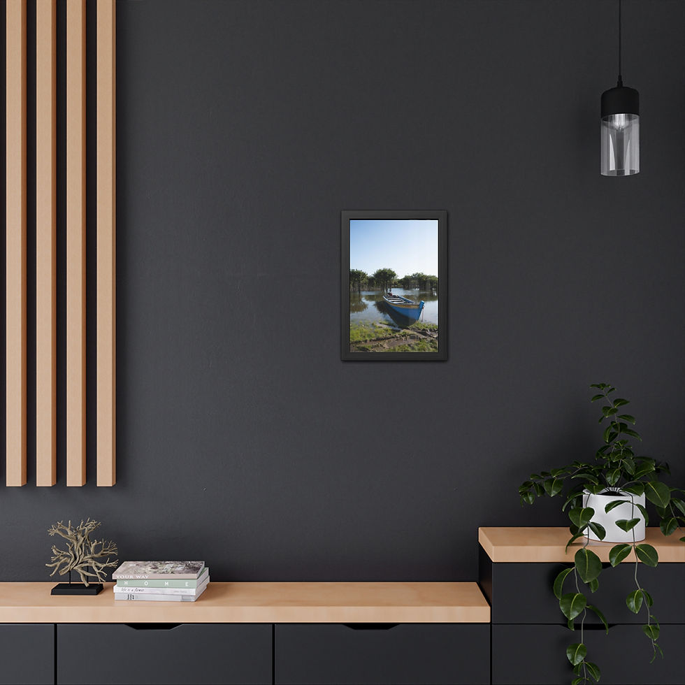 Thumbnail: Framed art showing blue boat on river with green banks, blue sky.