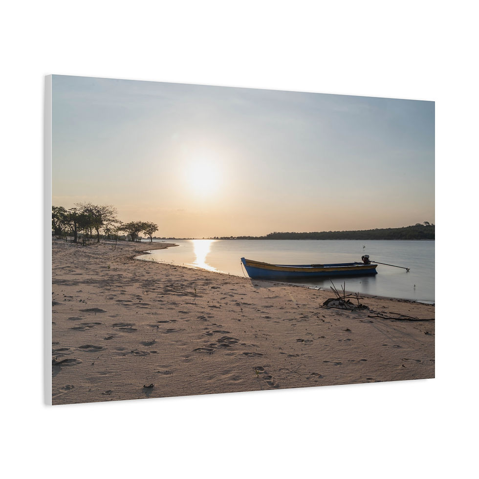 Thumbnail: Small boat on sandy beach, golden sunset reflecting on water.