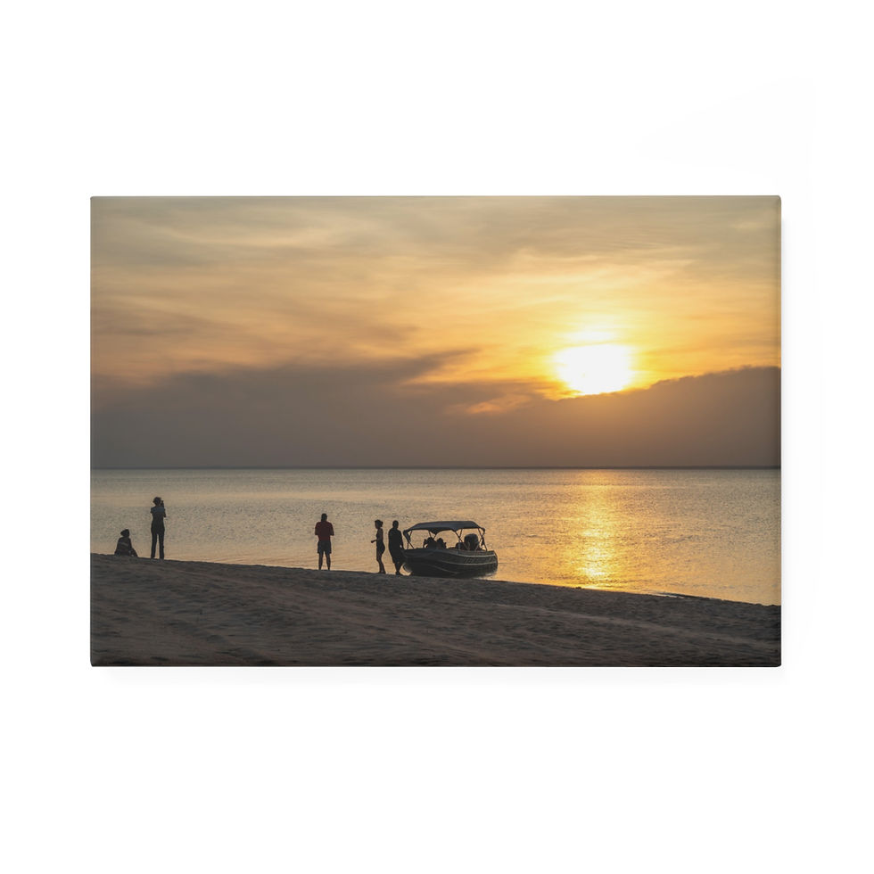 Thumbnail: People and golf cart on beach watching golden sunset over ocean.