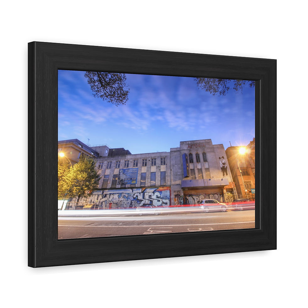 Thumbnail: Framed urban night scene of modern building with vibrant vehicle light trails.