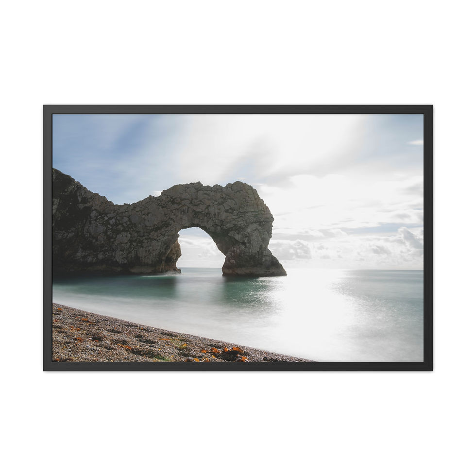 Thumbnail: Durdle Door rock arch on beach with shimmering sea and cloudy sky