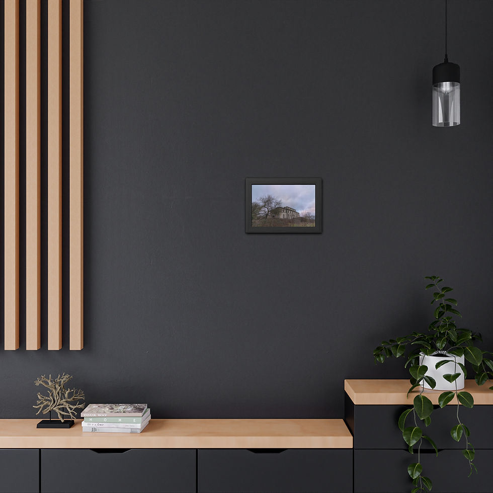 Thumbnail: Small framed landscape picture hangs on dark wall above a wooden shelf.