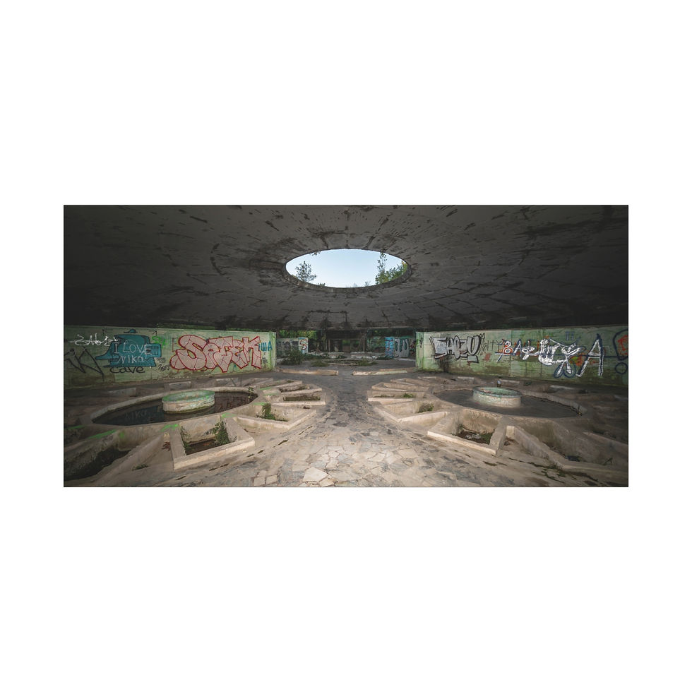 Thumbnail: Graffiti-covered concrete bunker interior, circular ceiling opening, abandoned floor structures.
