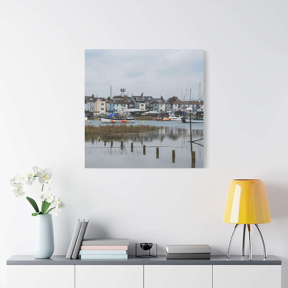 Thumbnail: Coastal town harbor with boats and houses reflecting on calm water.