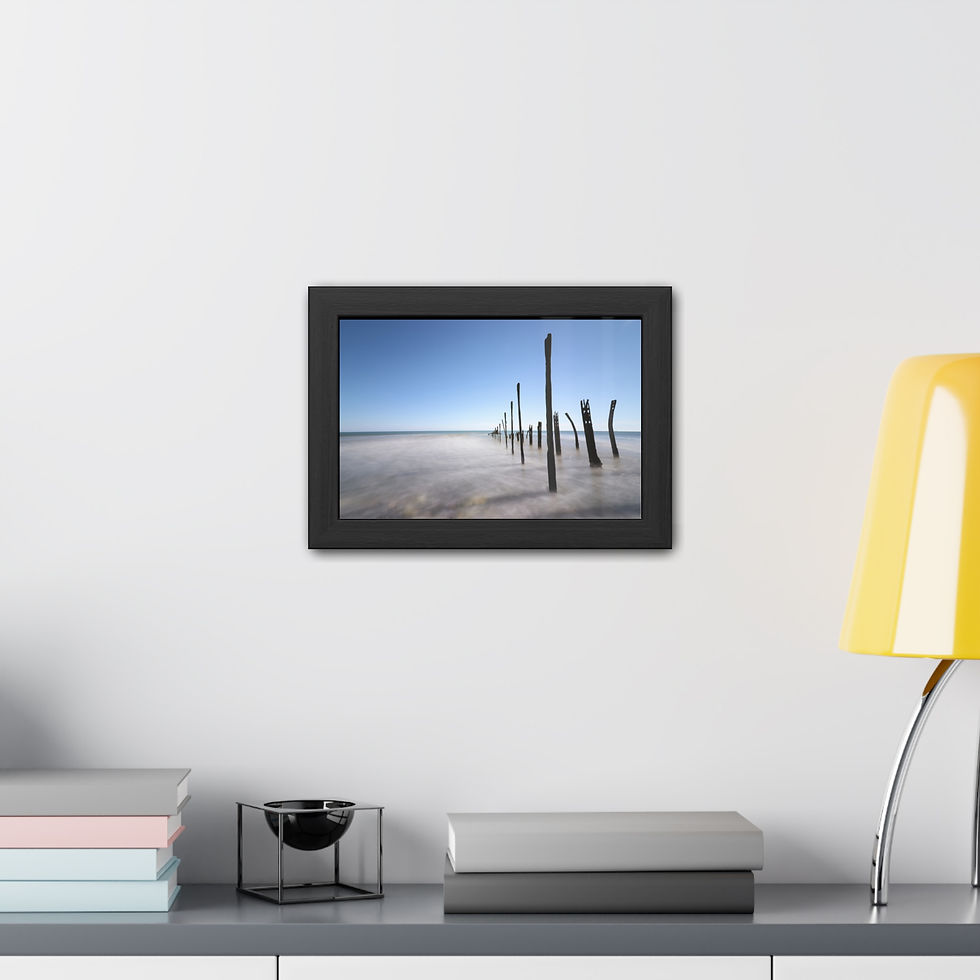 Thumbnail: Framed artwork of wooden posts in calm water, bright blue sky.
