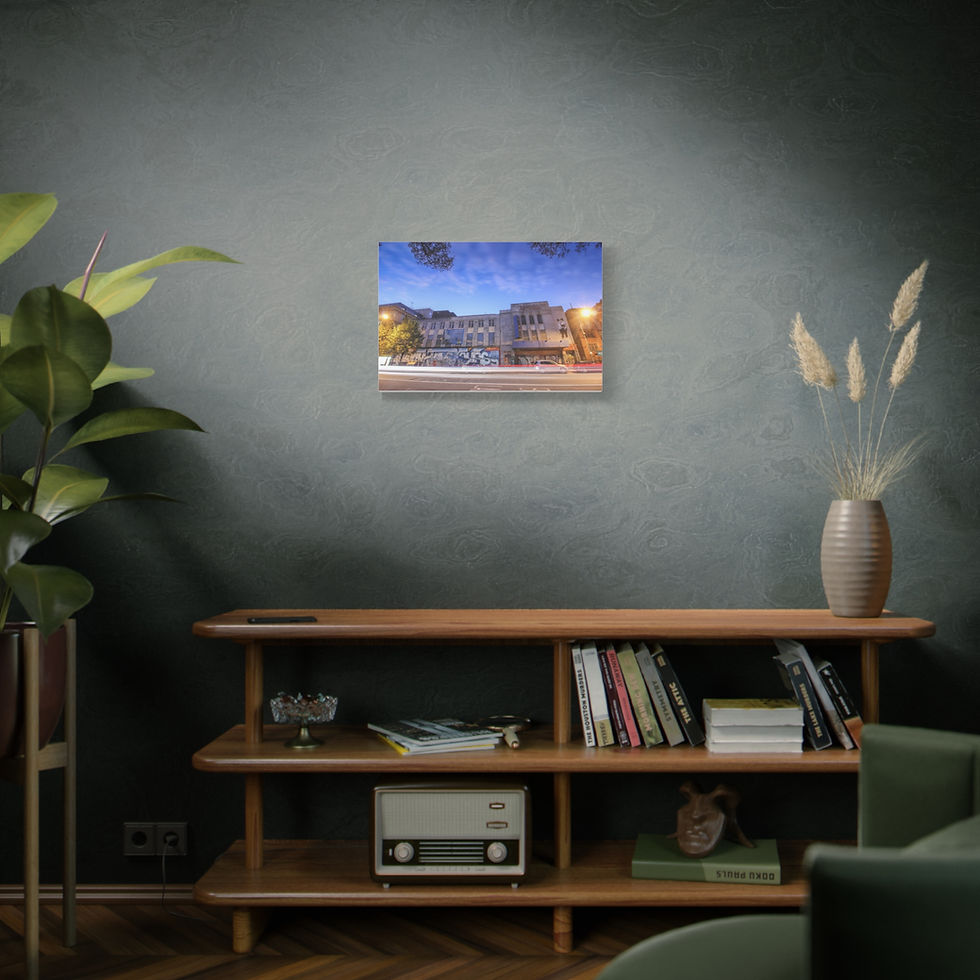 Thumbnail: Room decor with canvas print of illuminated building, wooden shelf.