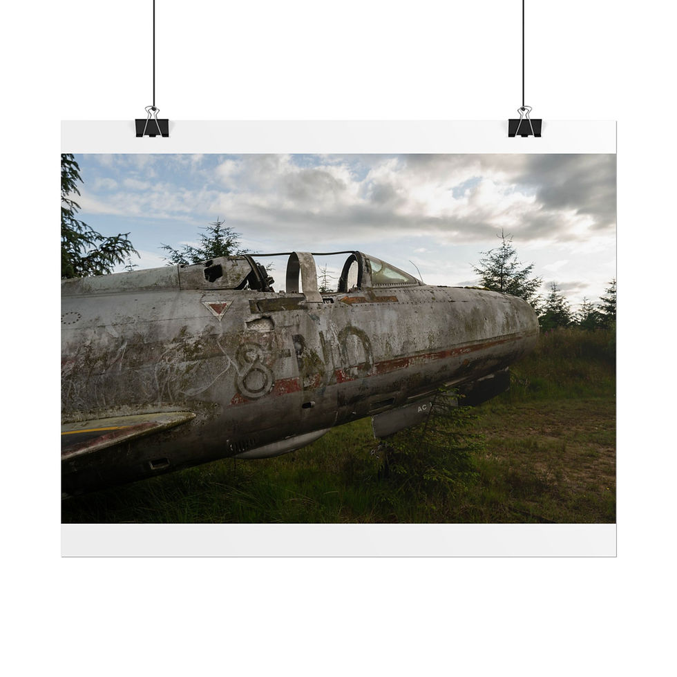 Thumbnail: Weathered, abandoned jet fighter fuselage rests in a rustic, overgrown field.