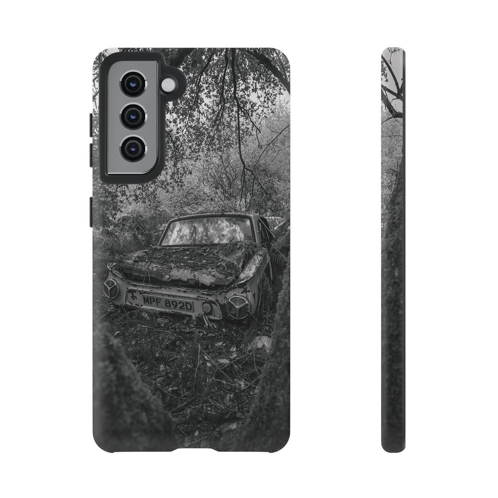 Thumbnail: Phone case with black and white abandoned car in overgrown forest design.