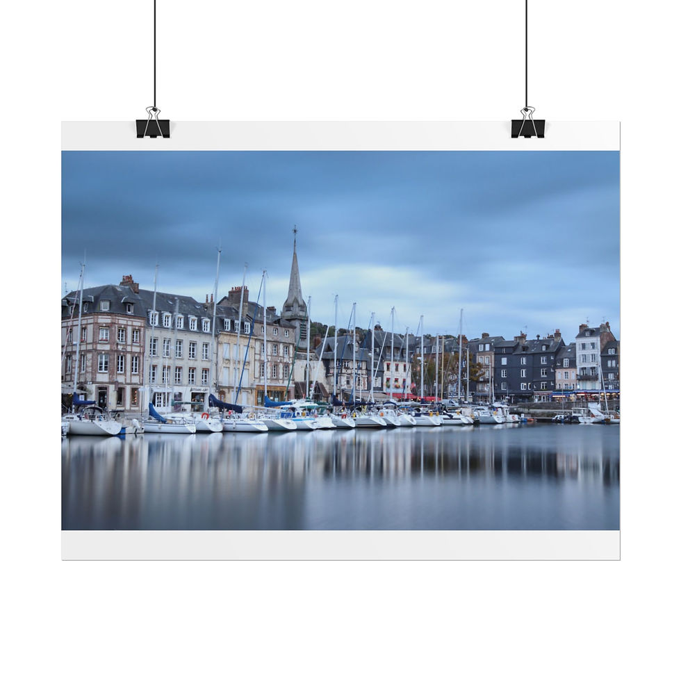 Thumbnail: Picturesque harbor town with boats, historic buildings, and spire reflected.