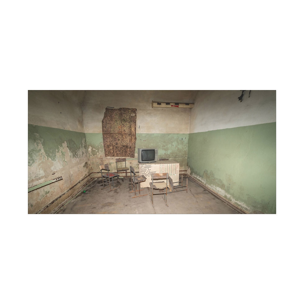 Thumbnail: Decaying abandoned room with vintage TV, chairs, and peeling green paint.
