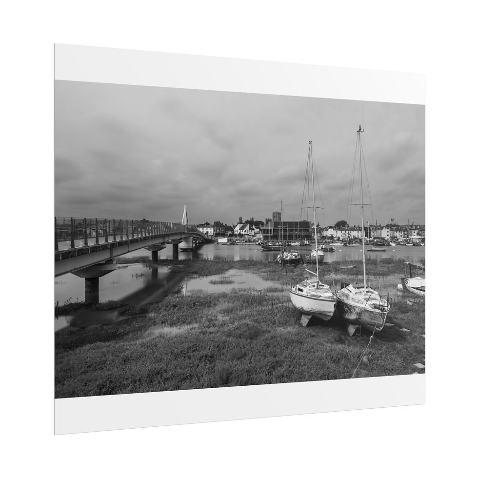 Thumbnail: Two boats on muddy shore in black and white, bridge, cloudy sky.