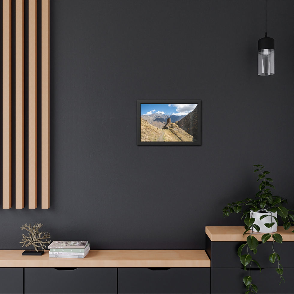 Thumbnail: Framed print displaying a rugged mountain landscape with blue sky on dark wall.