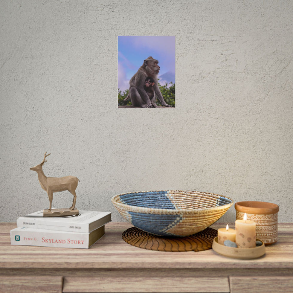 Thumbnail: Framed print shows mother monkey cradling baby amidst green foliage, blue sky.