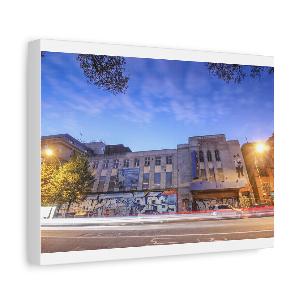 Thumbnail: Urban street scene at night, blurred car trails, illuminated buildings.