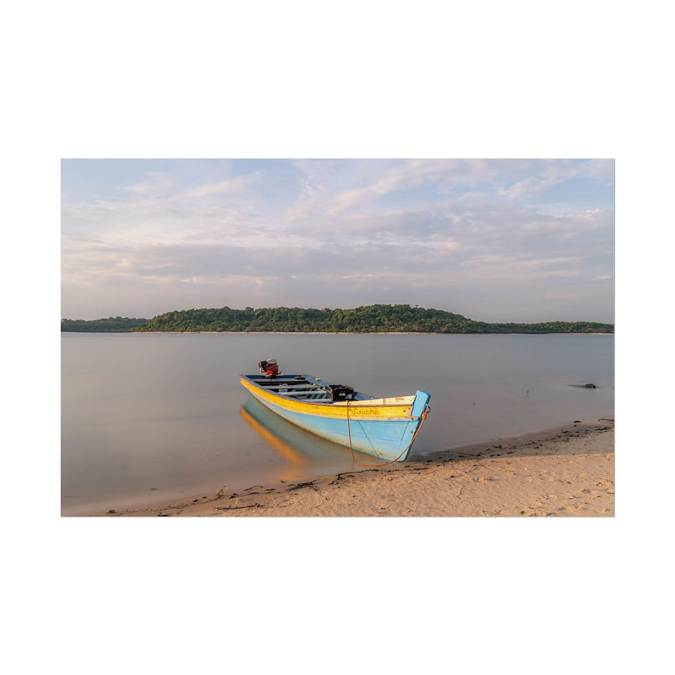 Thumbnail: Light blue and yellow boat on sandy shore by calm water, cloudy sky.