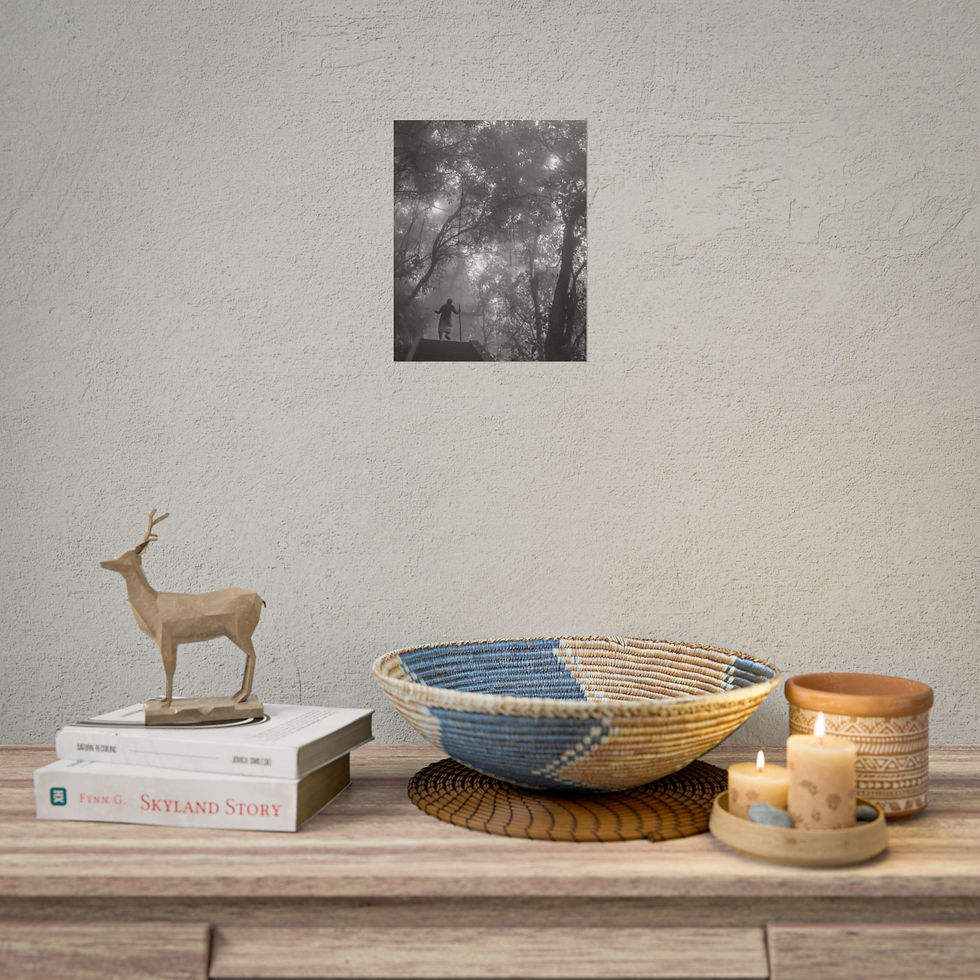 Thumbnail: Black and white forest print decorates wall above books, bowl, and candles.