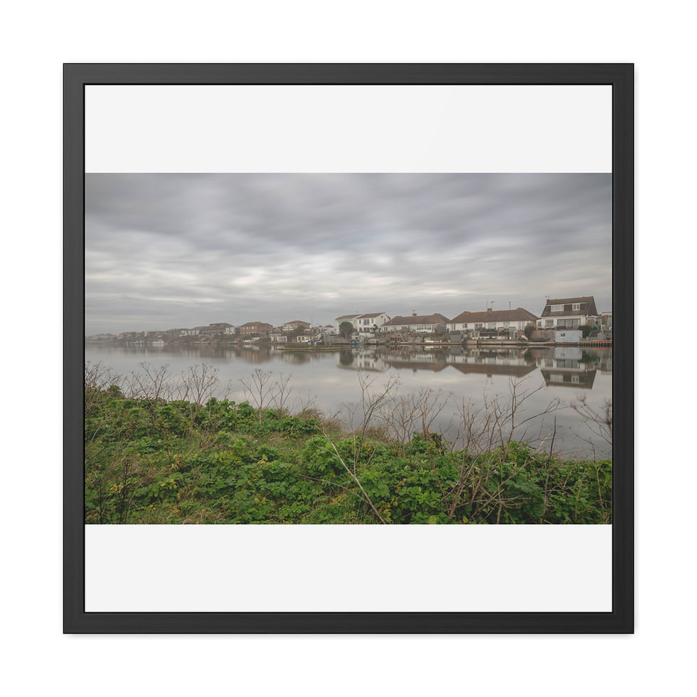 Thumbnail: Framed print shows houses reflected in calm water under a cloudy sky.