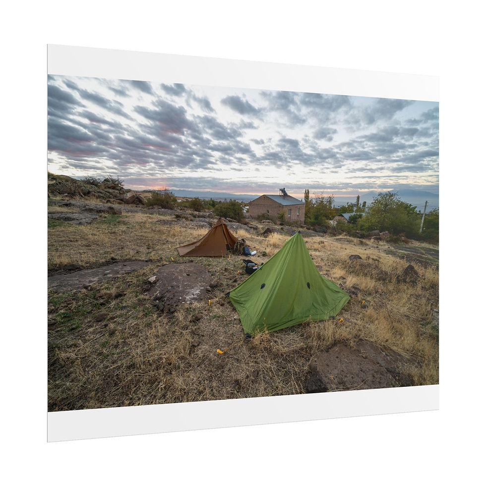 Thumbnail: Two tents camping in a dry, rocky landscape under a dramatic cloudy sky.