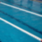Clear blue lap pool with swimming pool maintenance tips.
