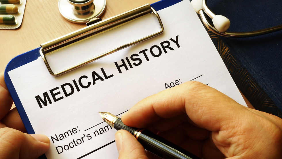 Hand filling out a Medical History form on a clipboard with a pen; visible text includes Name, Doctor’s name, and Age.