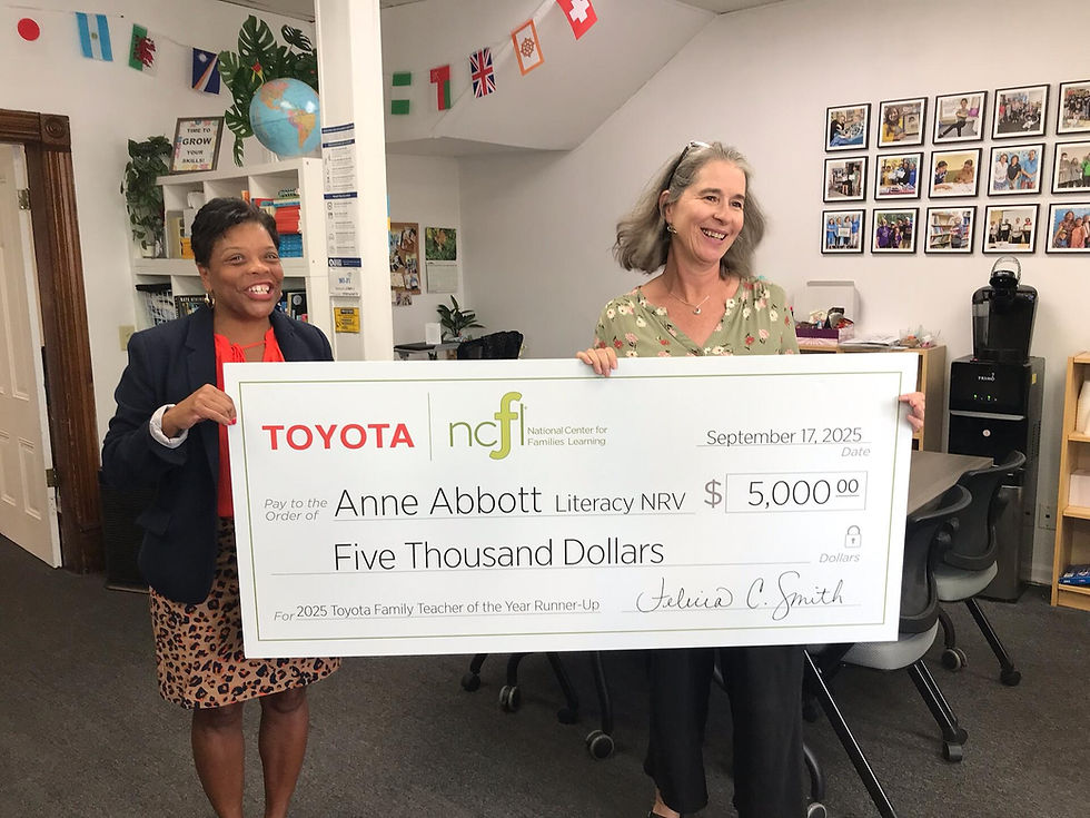 Anne Abbott (right) is presented with a $5,000 donation for Literacy NRV by Dr. Felicia Smith (left), President of the National Center for Families Learning