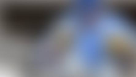 Technician performing gas cylinder safety inspection in an industrial facility in Malaysia, checking valves and pressure compliance.