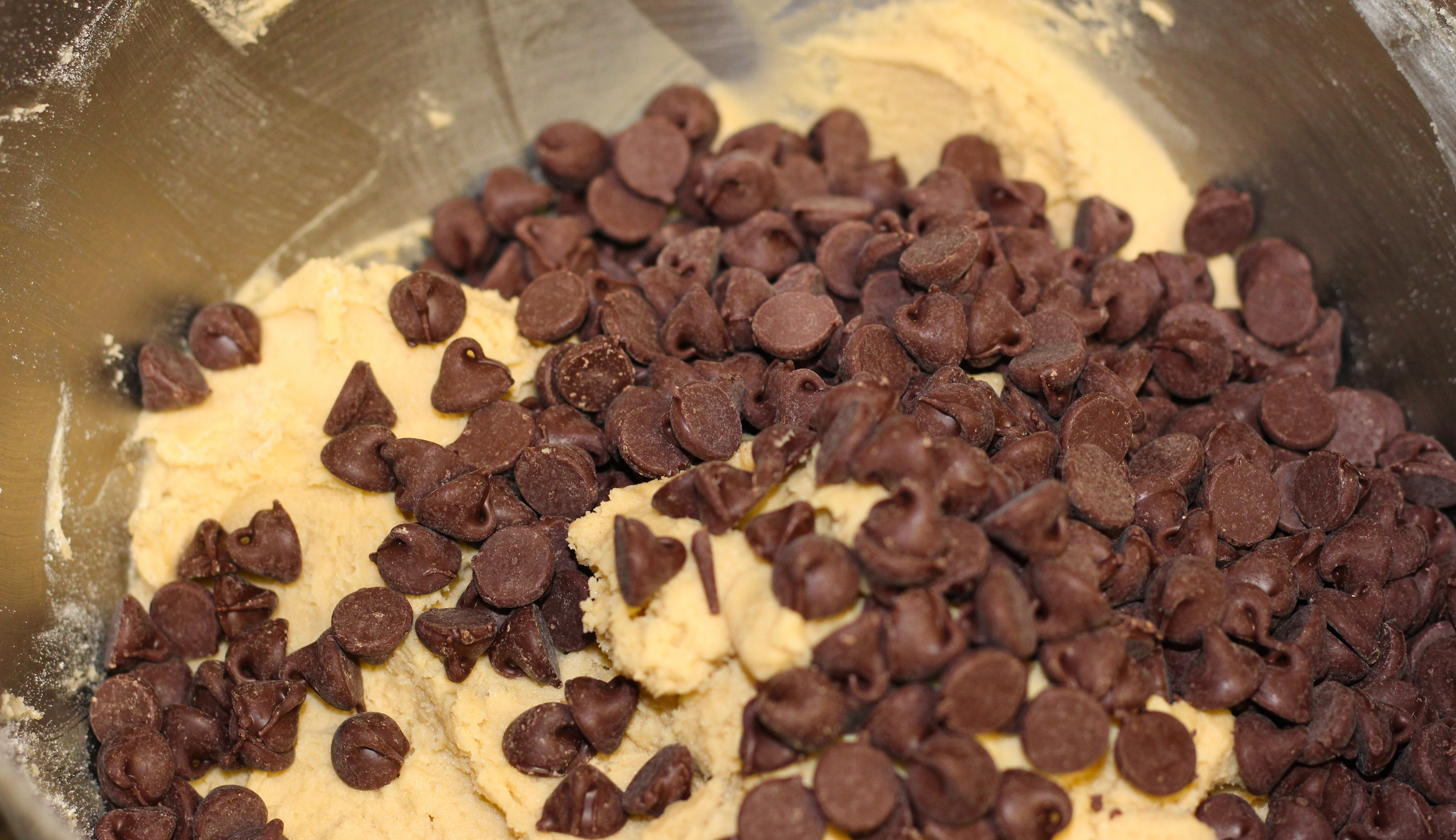 Cookie dough with chocolate chips on top.