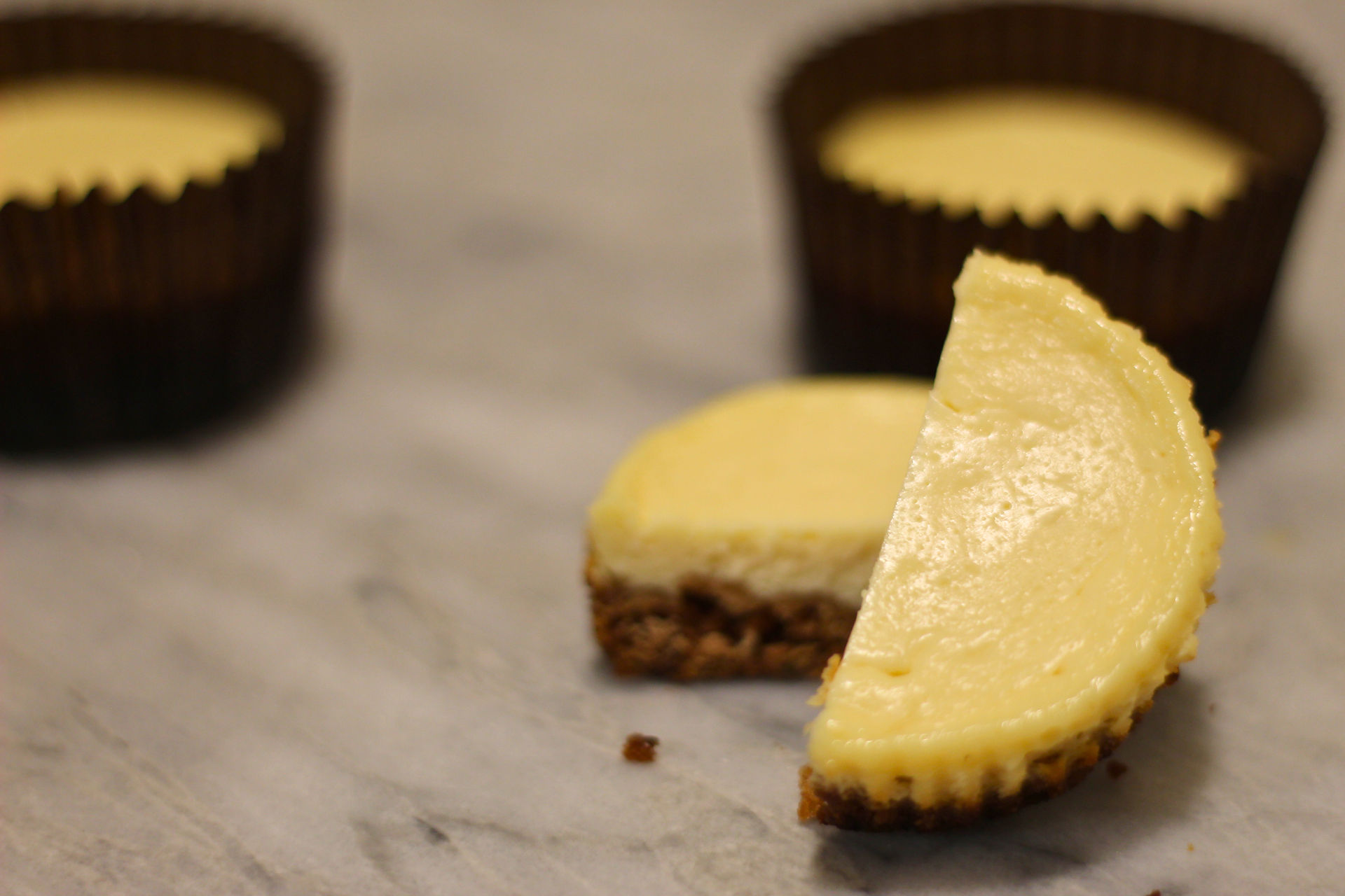 A cut cheesecake with granulated sugar.